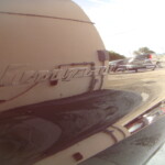 Before and after photographs of a damaged Chevy Impala that was repaired by Elite Paint & Body Shop in West Palm Beach, Florida.